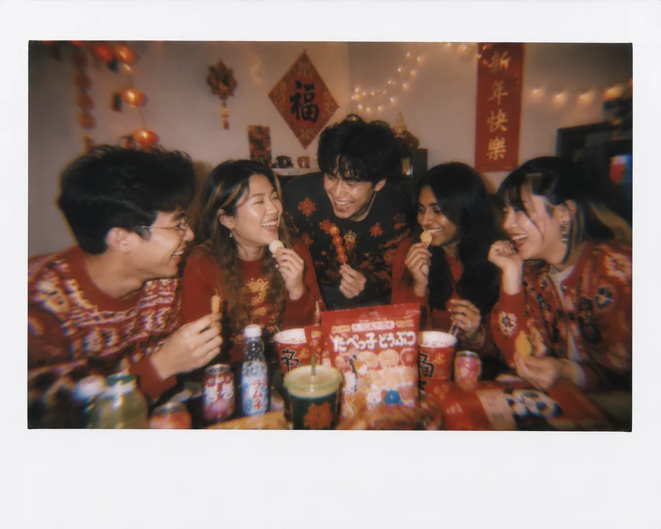 Students enjoying snacks together at a cultural gathering