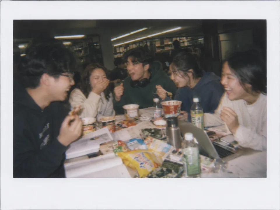 Friends sharing Asian food around a table