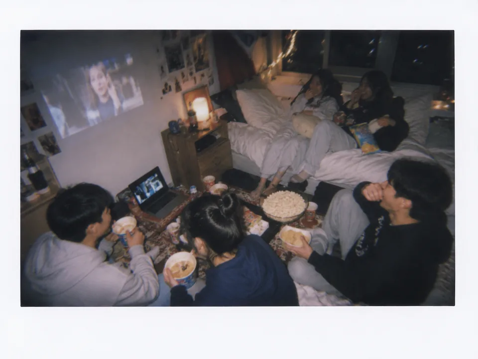 Students gathering around food during a club event